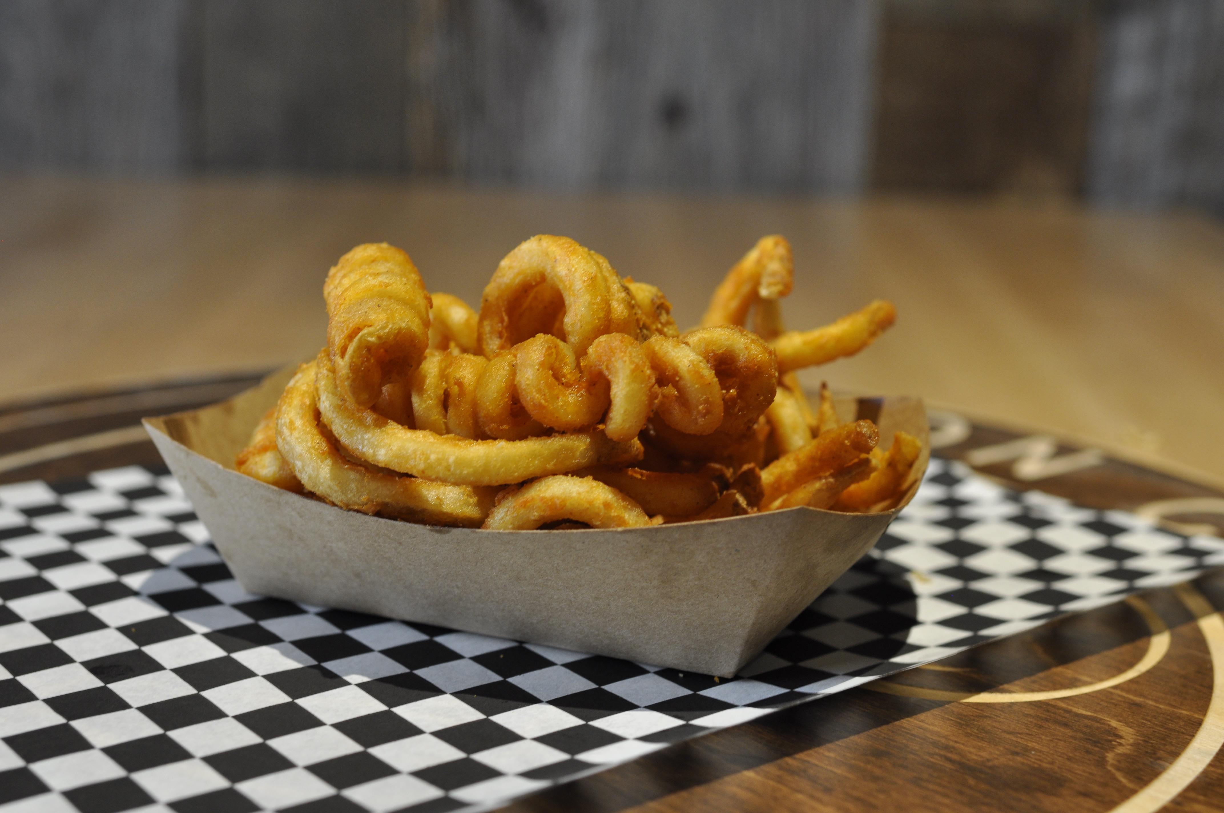 Curly Fries - Seasoned curly fries, fried crispy & golden....